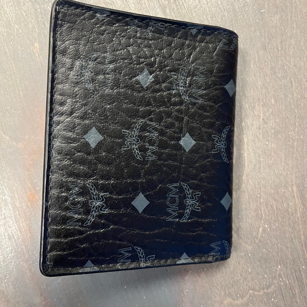 MCM Black Gray Bifold Wallet Silver Interior. Button closure. Leather.